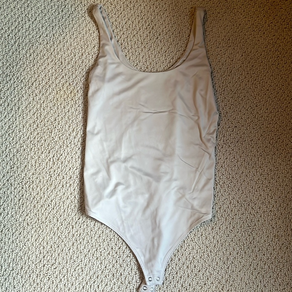 Abercrombie light beige bodysuit in size small. Slight sheen
